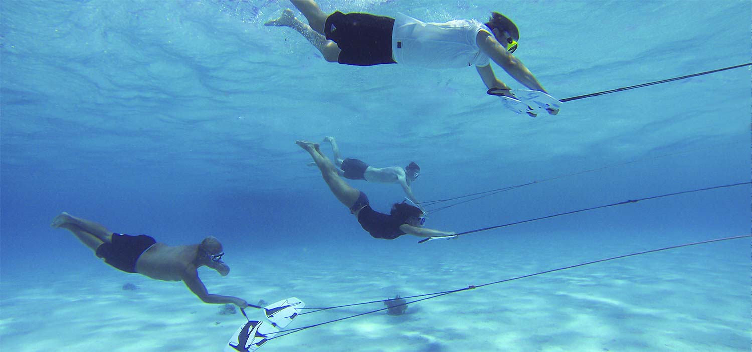 multiple riders subwinging under water