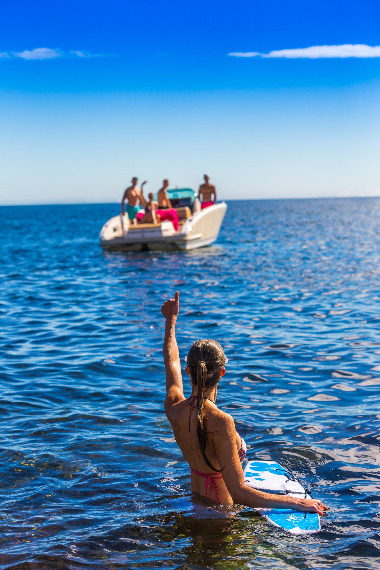 girl showing thumbs up in water ready for subwinging