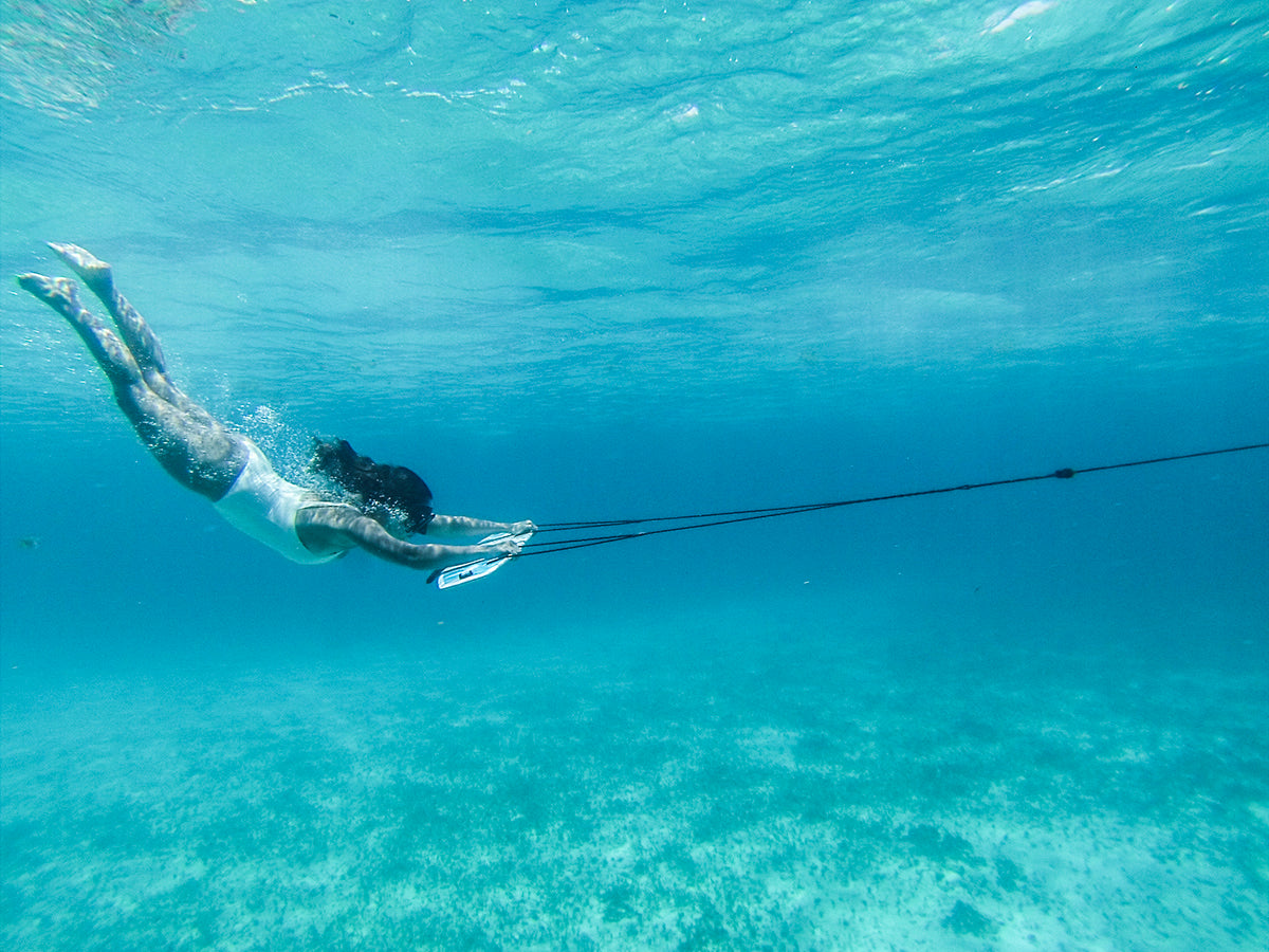 girl diving down on subwing