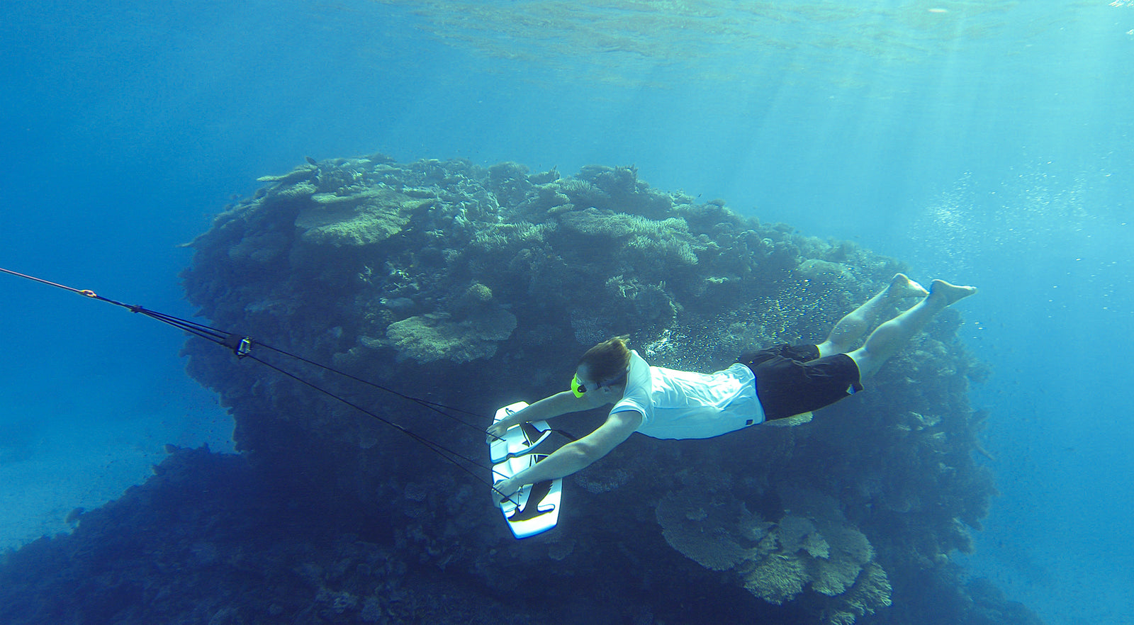 Diving with subwing past coral head