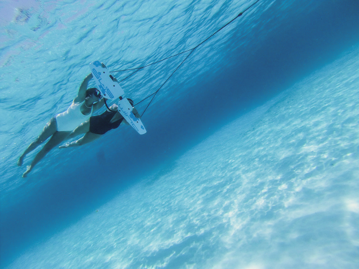two girls on one subwing white sand bottom
