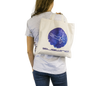 Woman holding cotton beach bag with Subwing logo