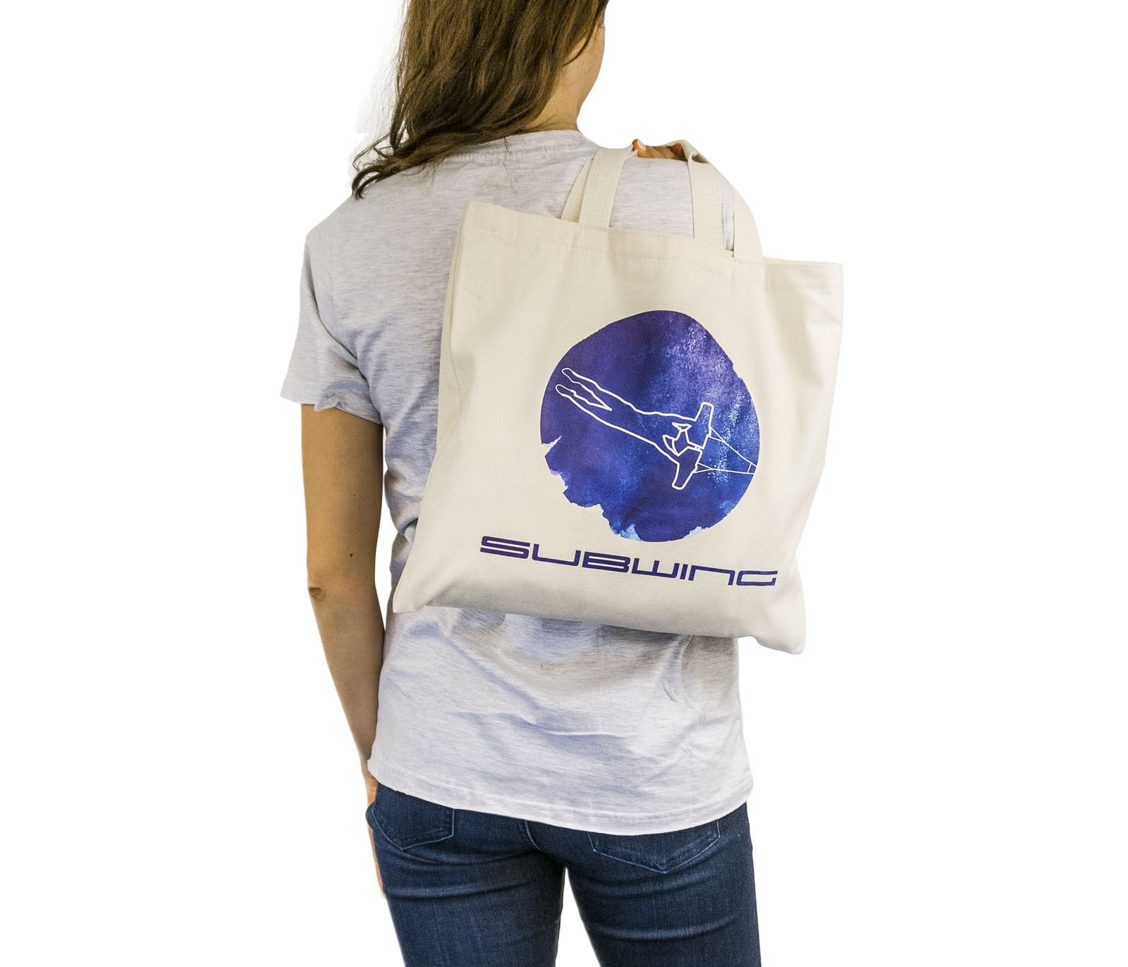 Woman holding cotton beach bag with Subwing logo