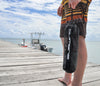 Man on dock holding Subwing towing rope in bag
